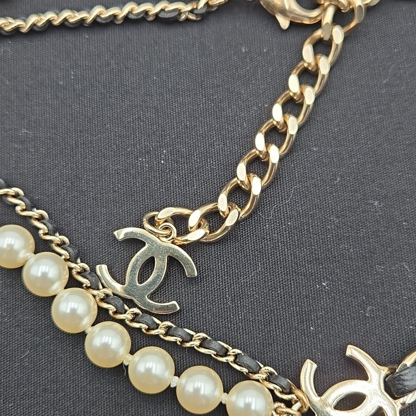 #112 Chanel Coco Mark, Matelasse Bag Motif, Faux Pearl, and Leather - B21SAB6125