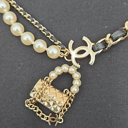 #112 Chanel Coco Mark, Matelasse Bag Motif, Faux Pearl, and Leather - B21SAB6125