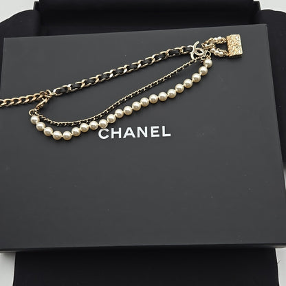#112 Chanel Coco Mark, Matelasse Bag Motif, Faux Pearl, and Leather - B21SAB6125