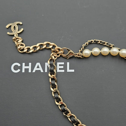 #112 Chanel Coco Mark, Matelasse Bag Motif, Faux Pearl, and Leather - B21SAB6125
