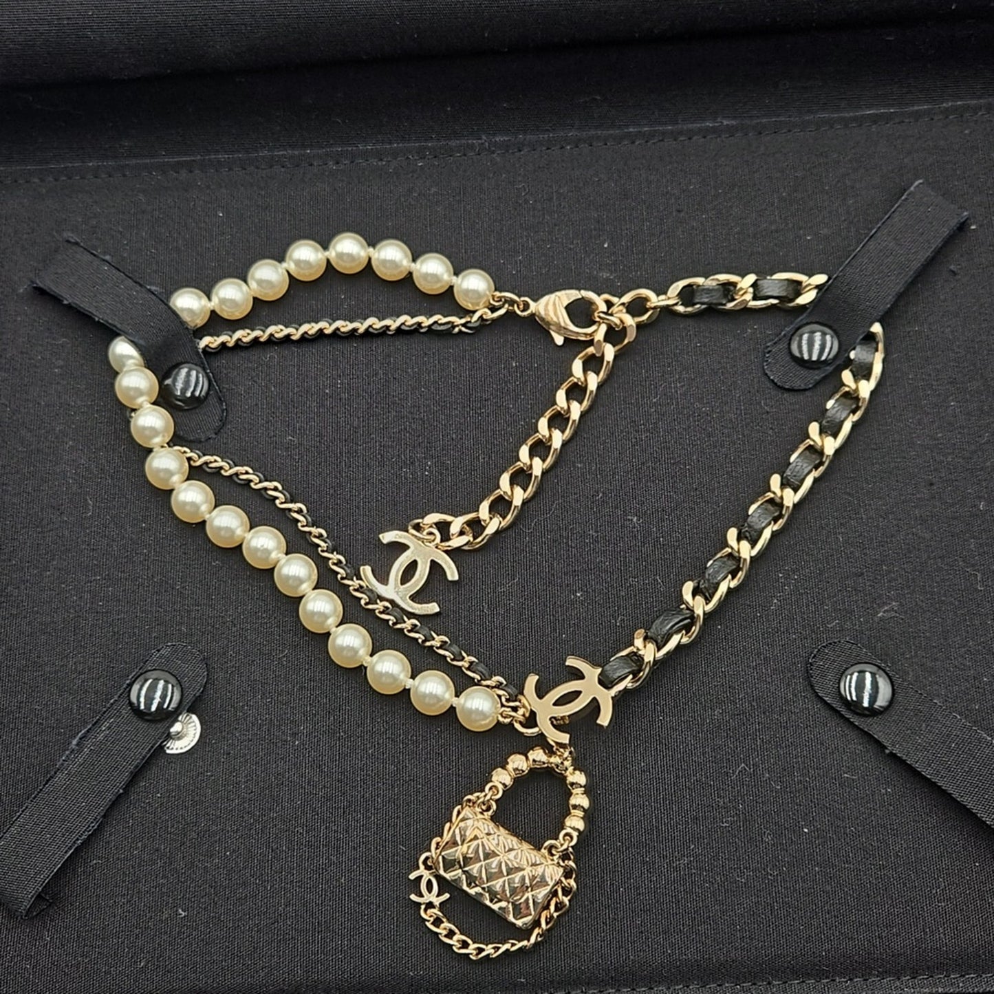 #112 Chanel Coco Mark, Matelasse Bag Motif, Faux Pearl, and Leather - B21SAB6125