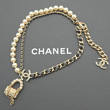 #112 Chanel Coco Mark, Matelasse Bag Motif, Faux Pearl, and Leather - B21SAB6125