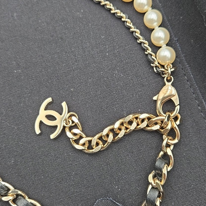 #112 Chanel Coco Mark, Matelasse Bag Motif, Faux Pearl, and Leather - B21SAB6125