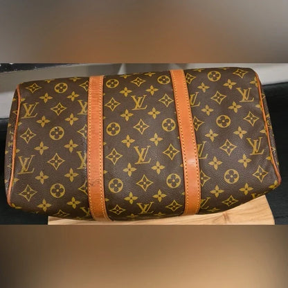 Louis Vuitton Brown Monogram Saxe Souple 35